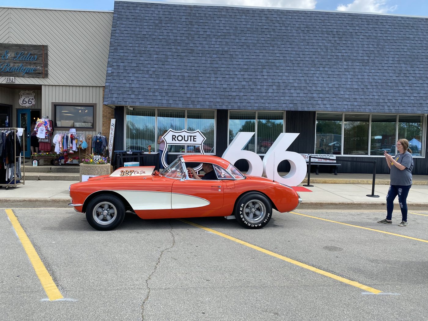 Classic Corvette at the Route 66 car show with large 66 display